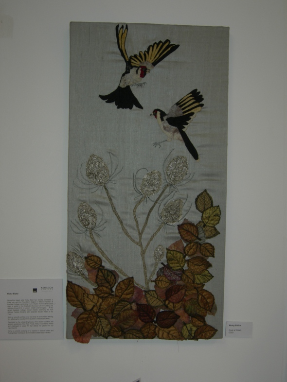 "embroidered birds and leaves"